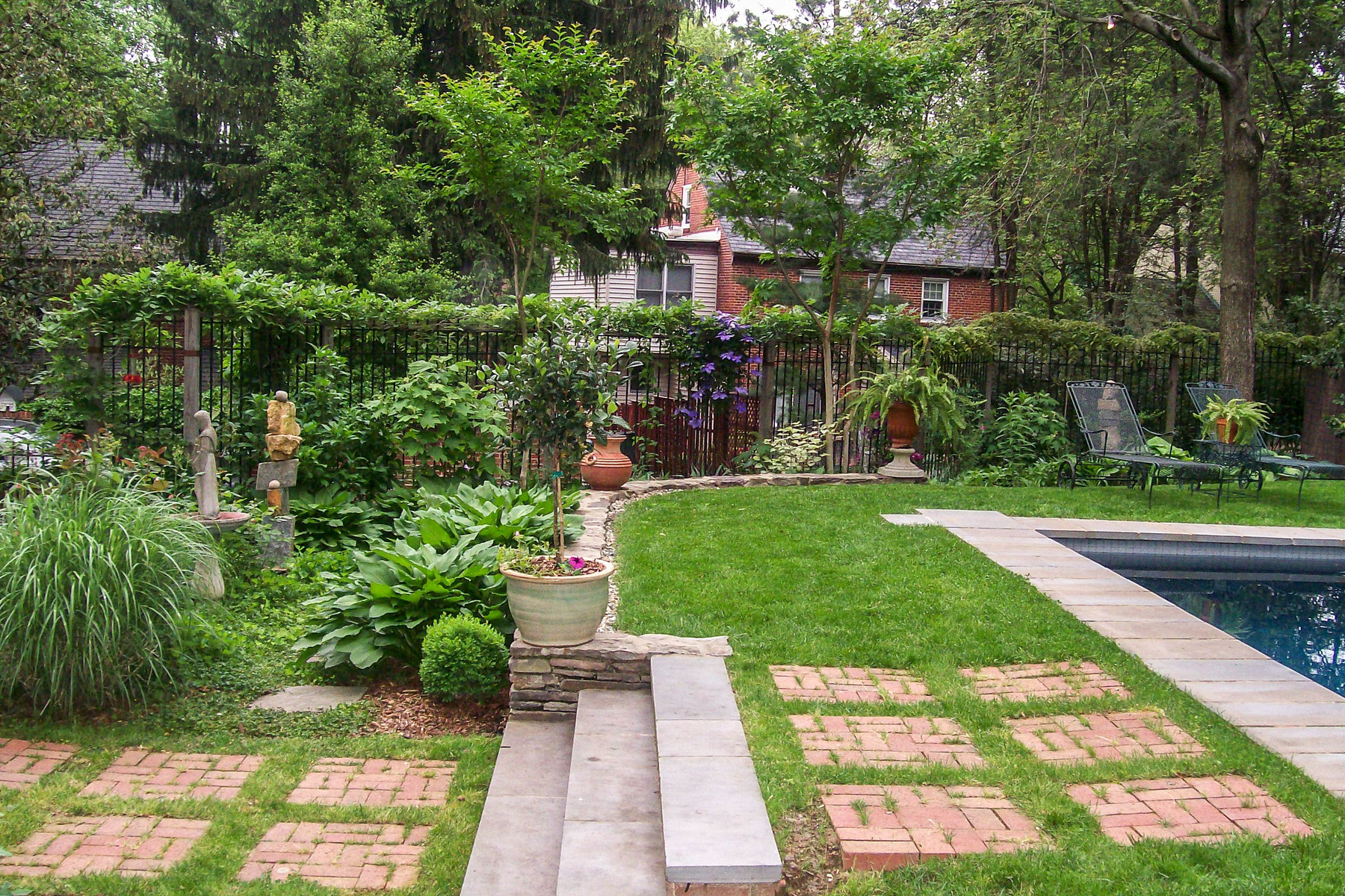 Paving can be softened with grass in between the stones instead of mortar. : Garden Details : CITYSCAPES® Landscaping LLC