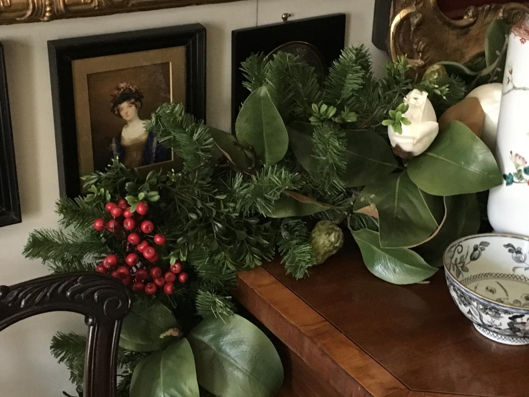 Faux Magnolia and evergreen garland graces a sideboard. : Holiday Decorating, Faux Plant and Flower Installations : CITYSCAPES® Landscaping LLC