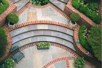 The geometry of this garden is softened by evergreens.