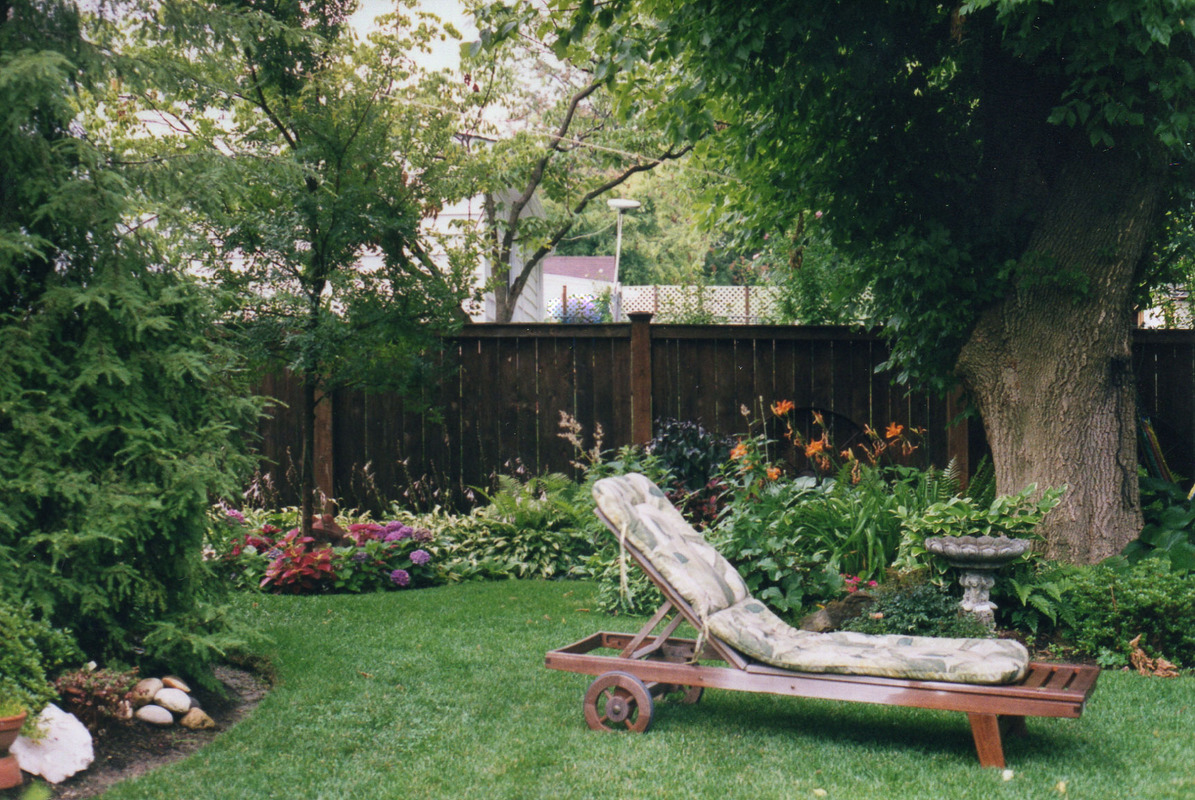 A nice shady spot to relax in this suburban back yard.
 : Suburban Gardens : CITYSCAPES® Landscaping Inc.