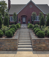 This huge hillside front garden is terraced into three separate garden areas. 