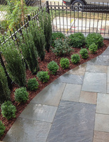 By curving the front walkway, balance is achieved for an off-center entry.