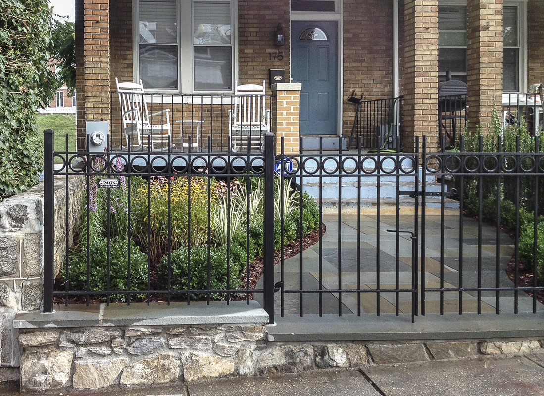 Stonework and ironwork set off this small front garden. : Front Gardens : CITYSCAPES® Landscaping Inc.