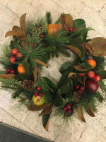Faux fruit in a holiday wreath