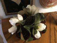 Faux Magnolia with real pine cones in a silver bowl
