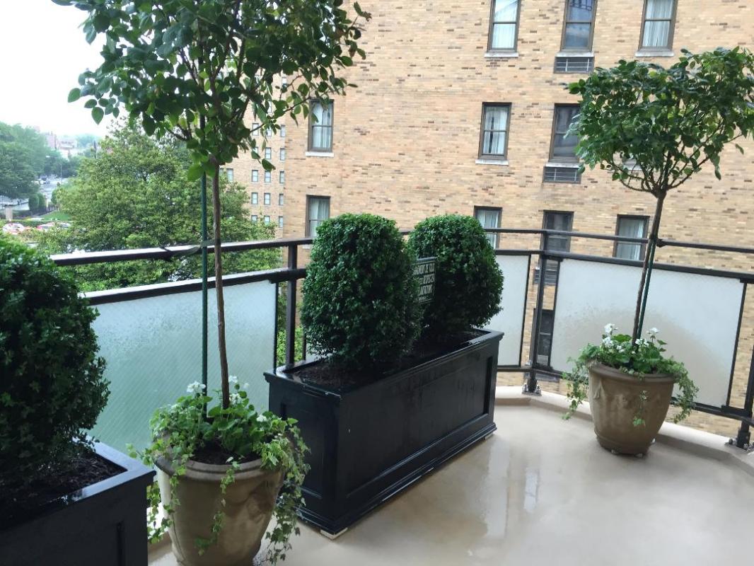 A formal garden in planters on a tiny pocket balcony
 : Rooftop and Balcony Gardens : CITYSCAPES® Landscaping LLC