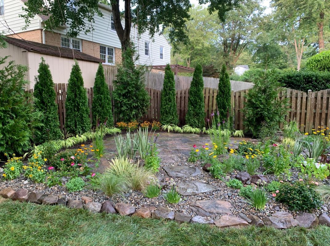 Newly installed rain garden and patio seating in Potomac. : Suburban Gardens : CITYSCAPES® Landscaping LLC