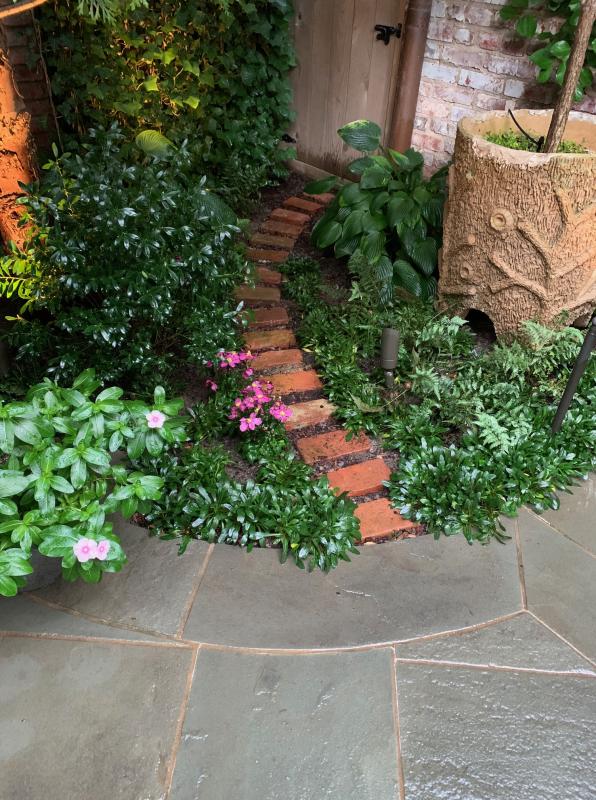 A small brick path leading to the utility area is very subtle. : Garden Details : CITYSCAPES® Landscaping LLC